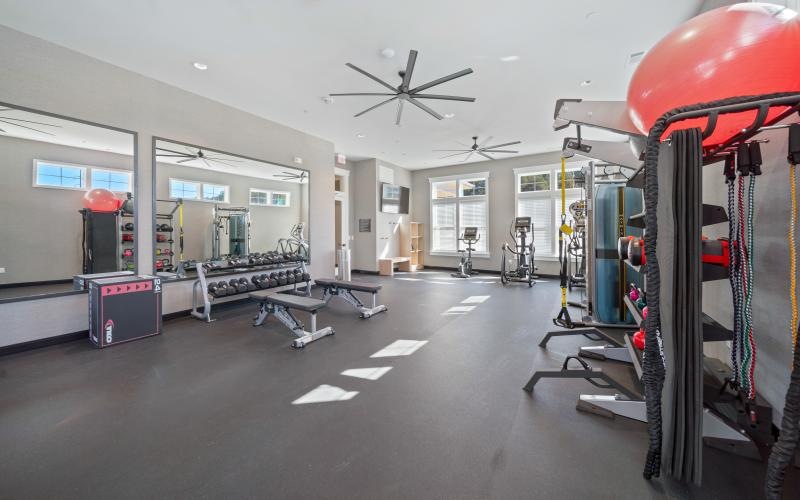 Cutting-edge amenities at your fingertips a gym with exercise equipment